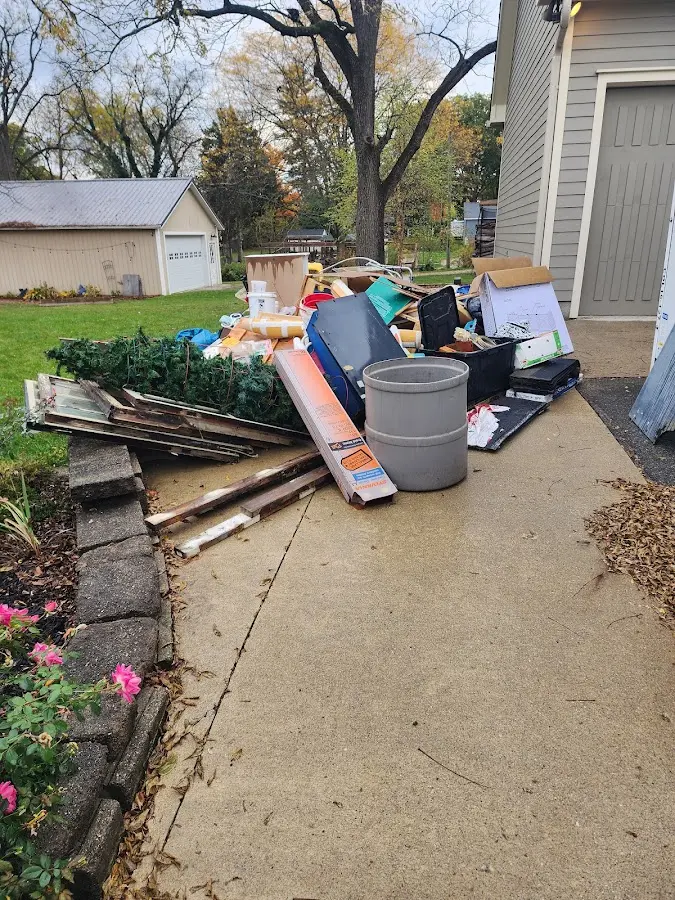 Dumpster being loaded with debris for Commercial Dumpster Rental in Myrtle Beach